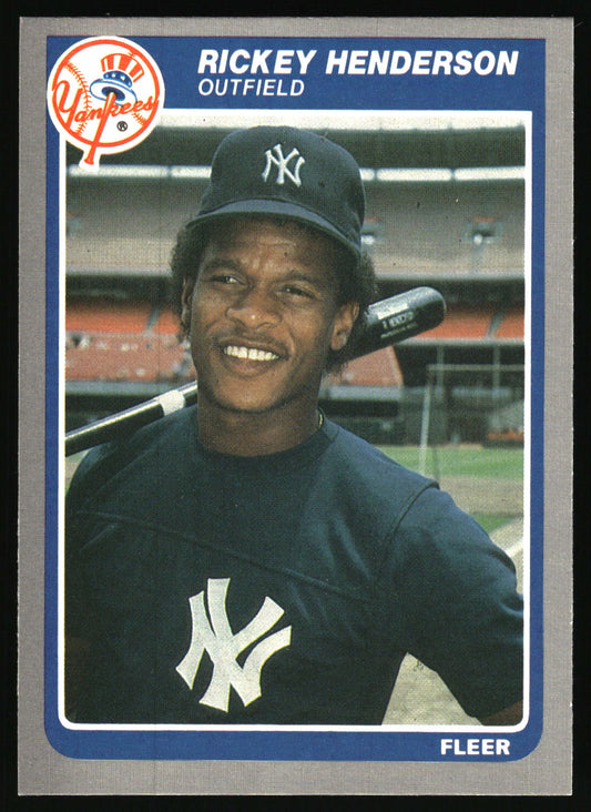 A vintage  baseball trading card featuring Rickey Henderson. The card shows a portrait of Henderson in a New York Yankees uniform, with his name and position printed at the top, and the Fleer logo at the bottom.