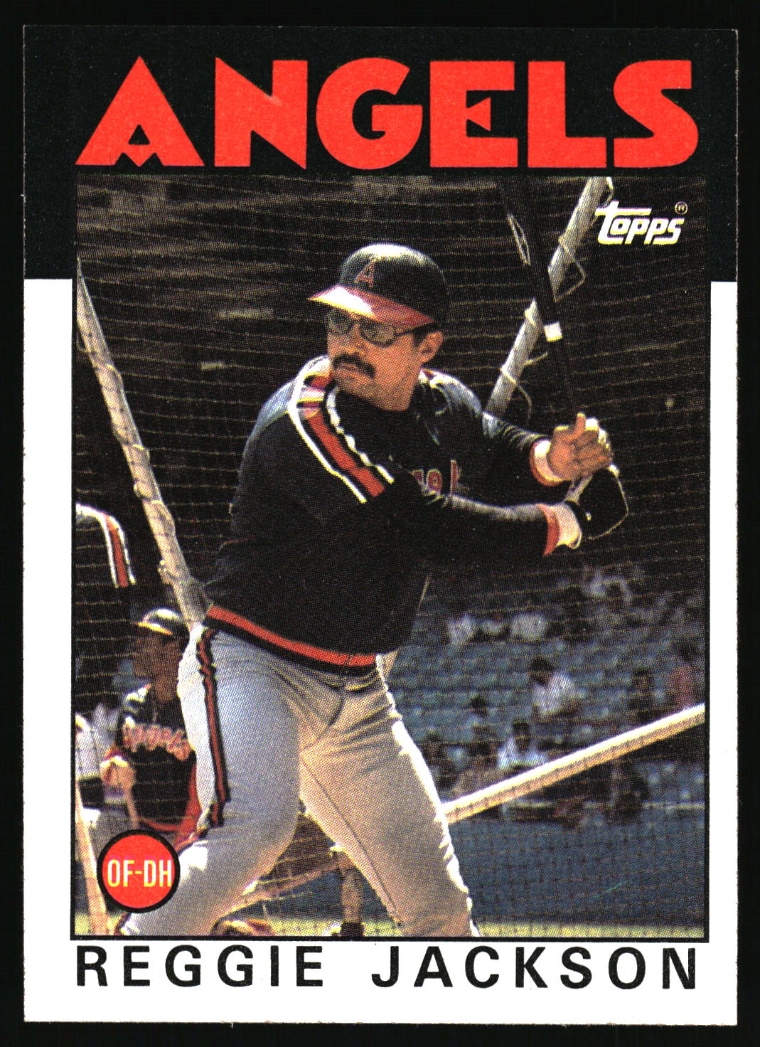 A vintage Topps baseball trading card featuring Reggie Jackson in a batting stance, with the large red word 'ANGELS' at the top and the Topps logo in the upper right.