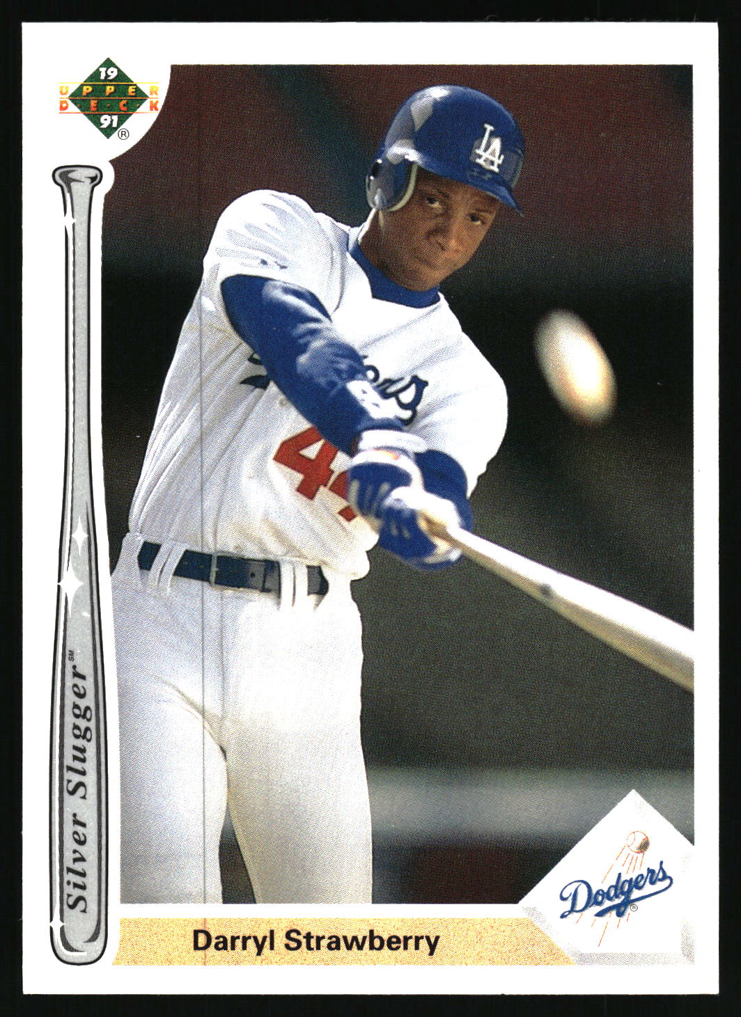 A vintage 1991 Upper Deck baseball trading card featuring Darryl Strawberry in a Los Angeles Dodgers uniform, shown holding a bat. The card includes a 'Silver Slugger' award emblem on the left and a 'Dodgers' logo on the bottom right.