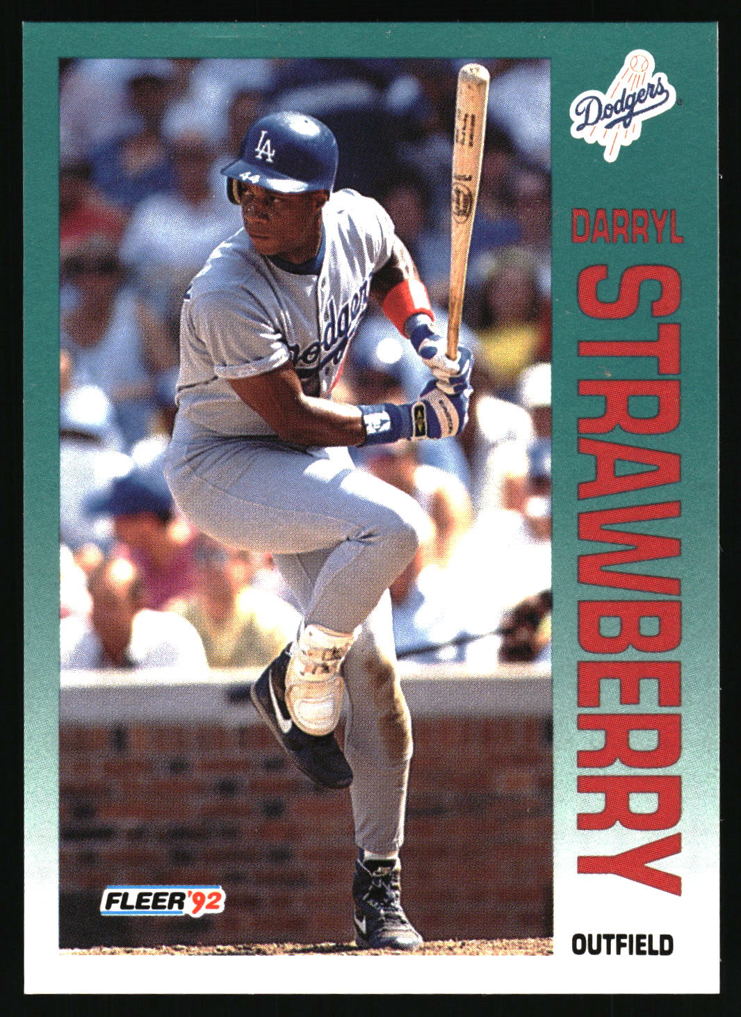 A vintage baseball trading card featuring Darryl Strawberry of the Los Angeles Dodgers. The card has a green border with 'Dodgers' and 'Strawberry' printed vertically, and a photo of Strawberry in a batting stance wearing a gray uniform and blue helmet.