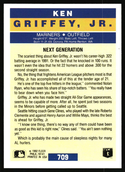 Back of a 1992 Fleer Ken Griffey, Jr. trading card showing player statistics, biographical text, and a yellow-and-blue header on a cream background.