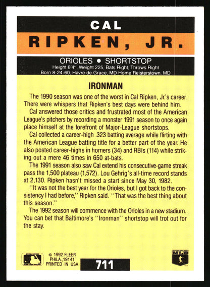 The back of a 1992 Fleer baseball trading card featuring player information for Cal Ripken, Jr., with a yellow body, black text, and an orange footer band.
