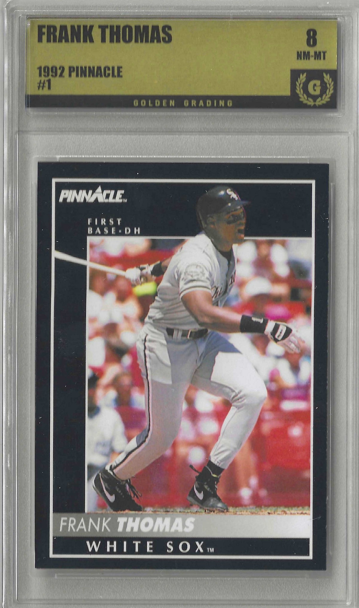 A graded 1992 Pinnacle baseball card of Frank Thomas, White Sox #1, encapsulated in a clear plastic grading case with a gold header. The card shows Frank Thomas in a batting stance wearing a white uniform.