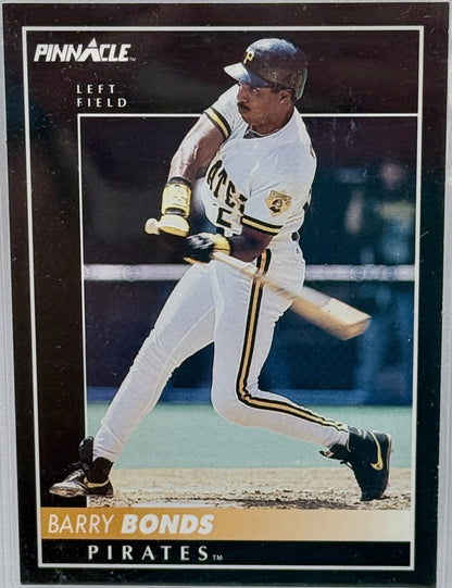 A vintage Pinnacle baseball trading card featuring Barry Bonds in a Pirates uniform mid-swing. The card has a black border with gold and white text and shows the Pinnacle brand logo at the top left.