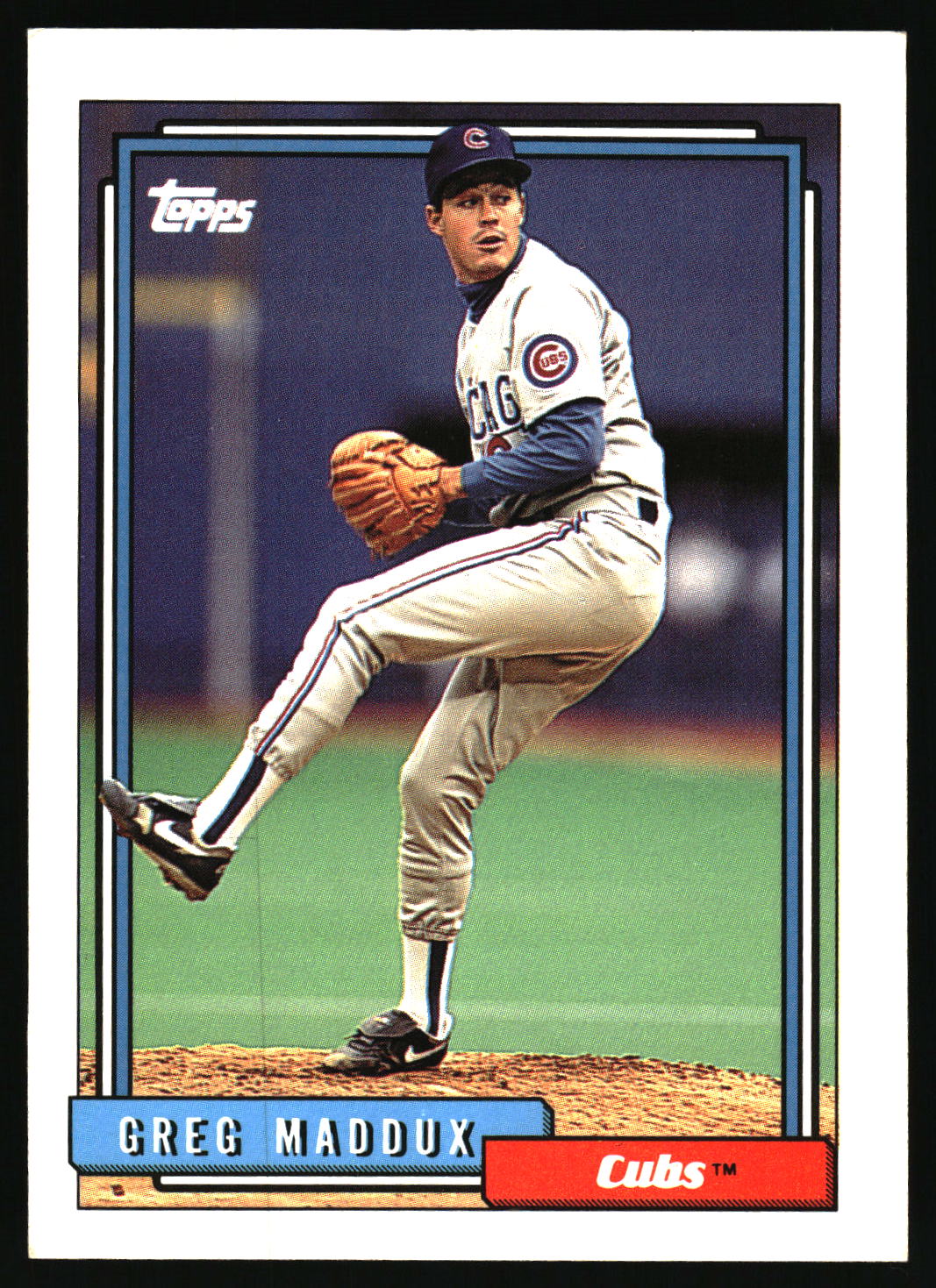 A vintage Topps baseball trading card featuring pitcher Greg Maddux in a Chicago Cubs uniform, shown with a black border and card details including the Topps logo and Cubs nameplate.