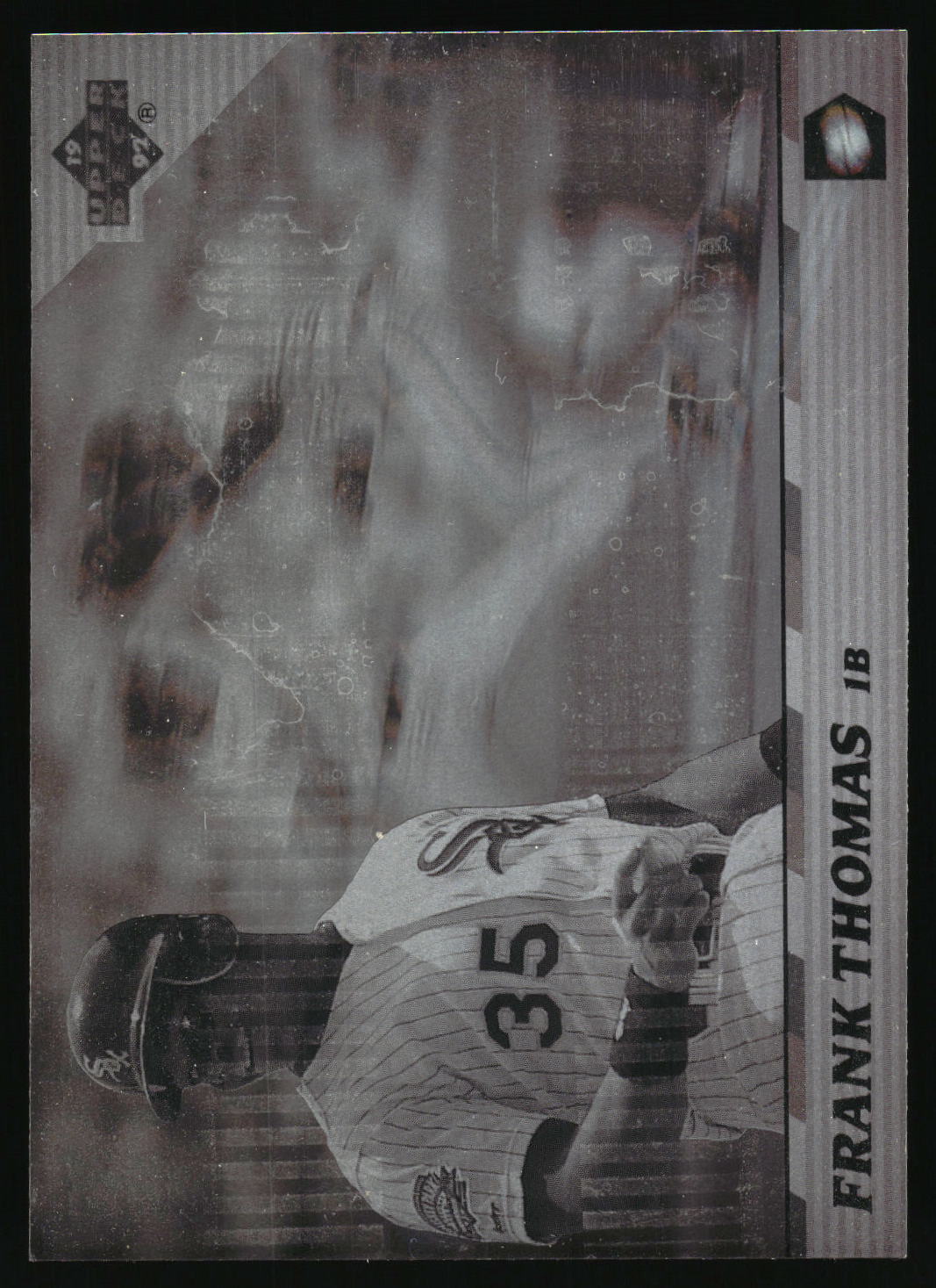 A vintage baseball trading card featuring Frank Thomas, a 1B player for the Chicago White Sox. The holographic photo of Thomas in his uniform and helmet, and vertical text on the right side reading 'FRANK THOMAS 1B'.