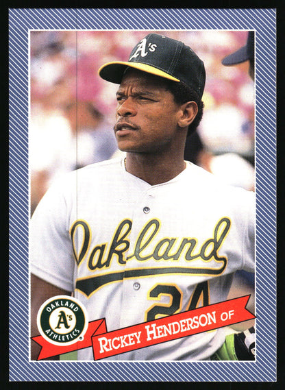 A vintage Oakland Athletics baseball trading card featuring Rickey Henderson in a white uniform and black cap with yellow trim, bordered by a blue striped frame with player text at the bottom.
