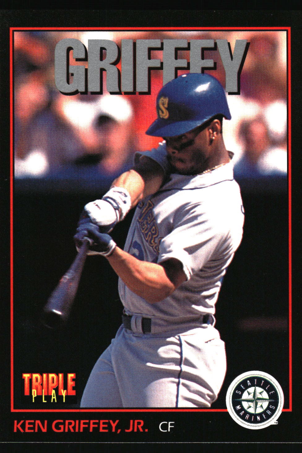 A vintage baseball trading card featuring Ken Griffey, Jr. in a batting stance, wearing a gray uniform and blue helmet.