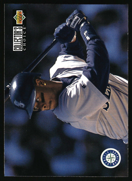 A vintage baseball trading card featuring a player in a Seattle Mariners uniform mid-swing, with the Upgraded Collectors Choice logo on the left and a Mariners logo on the bottom right.