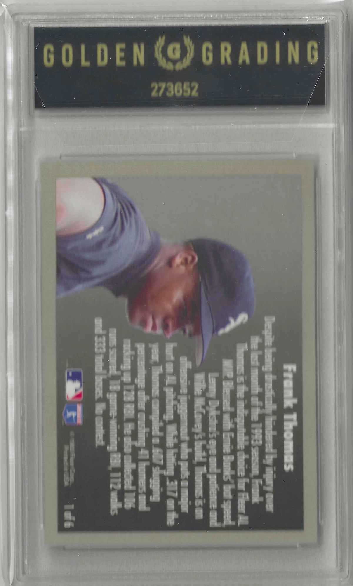 A collectible baseball trading card back featuring Frank Thomas, with a photo of him in a black cap and sleeve on the left, extensive white player statistics on a dark gray background, and MLB and Fleer logos at the bottom.