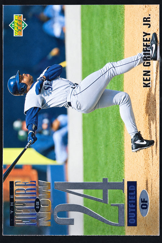 A Ken Griffey Jr. baseball trading card featuring a dynamic action photo of him batting, with his name printed vertically on the right side and a dark green and black card border.