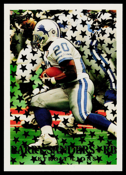 A vintage football trading card featuring Barry Sanders in a Detroit Lions uniform, running with a football. The card has a black star pattern overlay and the text 'BARRY SANDERS RB DETROIT LIONS' at the bottom.