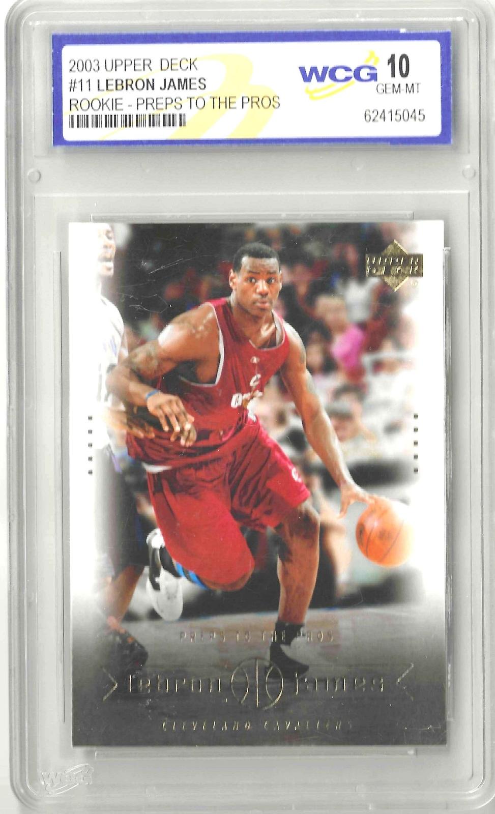 Vintage basketball trading card featuring a photo Lebron James dribbling a basketball, with upper deck logo in the top right.