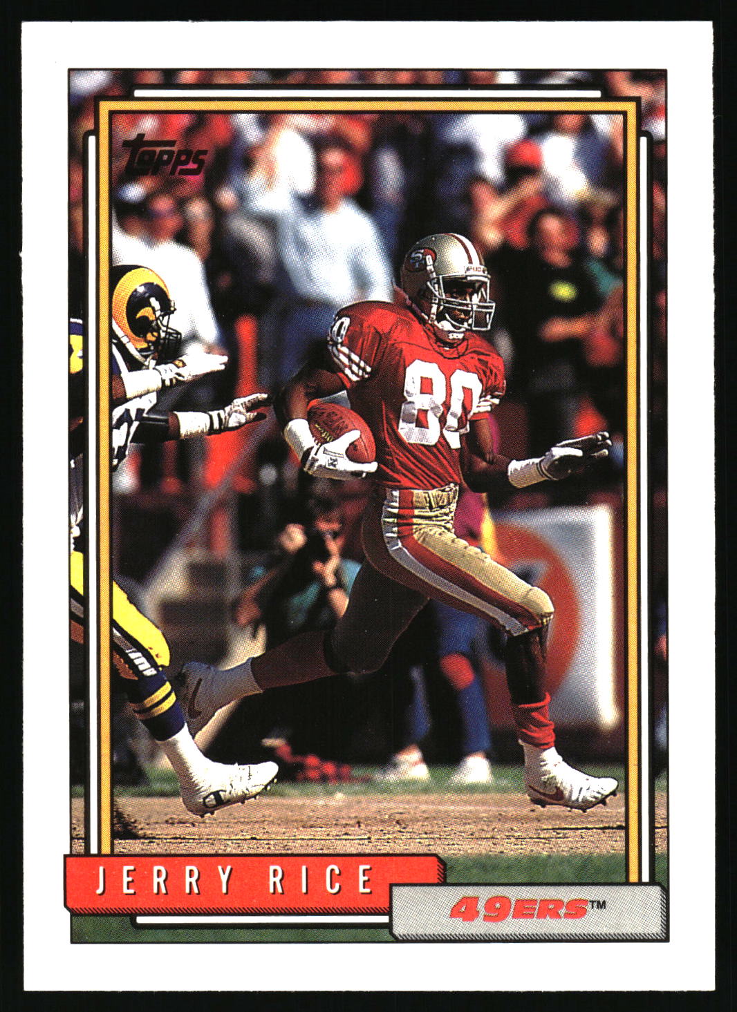 A vintage Topps Jerry Rice football trading card featuring Rice in a red 49ers uniform with the number 80, set against a black background.