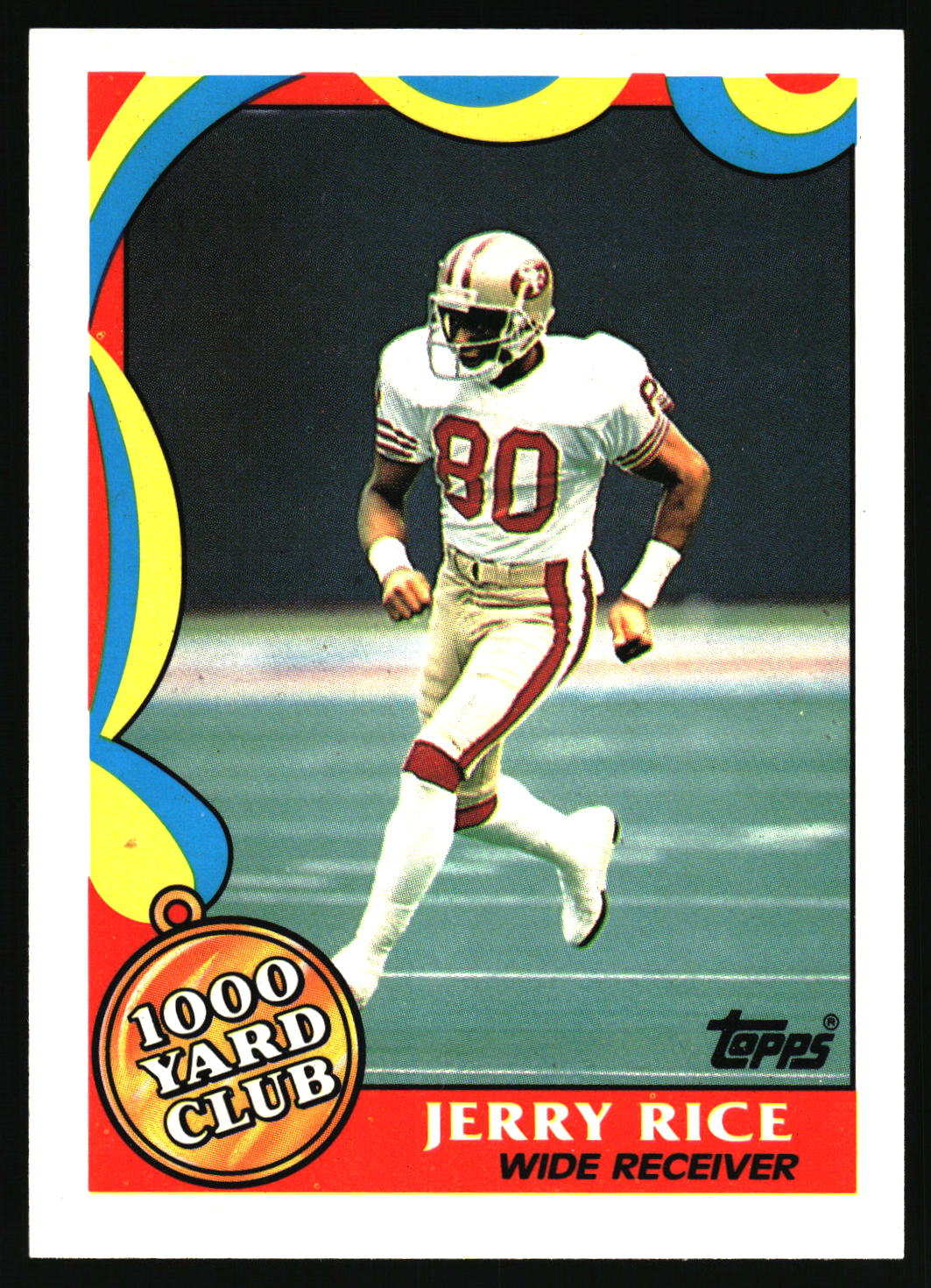 A vintage Topps football trading card featuring Jerry Rice, wide receiver for the San Francisco 49ers, wearing a white and red uniform with the number 80. The card has a colorful abstract border and a '1000 Yard Club' badge.