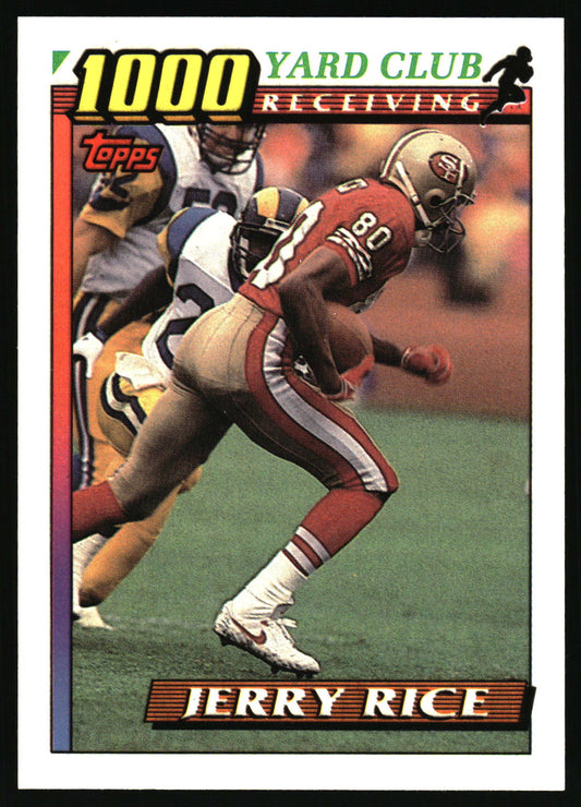 A vintage Topps football trading card featuring Jerry Rice in a San Francisco 49ers uniform running with the ball on the field, with the text '1000 Yard Club Receiving' and 'JERRY RICE'.