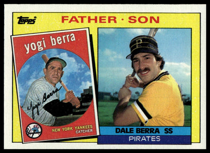 A vintage Topps baseball trading card featuring Yogi Berra and Dale Berra, labeled 'Father Son'. The card has a yellow border, a red header, and a blue footer, with printed photos of the two baseball players.
