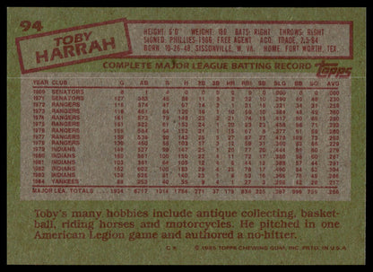 Back of a 1985 Topps baseball trading card featuring Toby Harrah, with a green background, red text, and a large table of career statistics in the center.