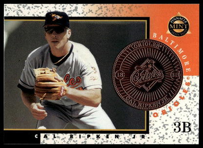 A baseball trading card featuring Cal Ripken Jr. in a Baltimore Orioles uniform, with a large circular patch of his Orioles jersey on the right side and card text including 'Baltimore Orioles', 'Cal Ripken Jr.