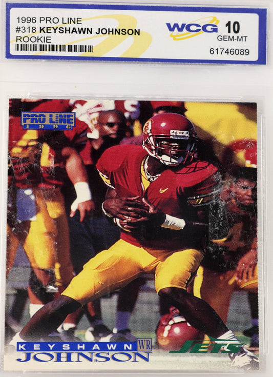 A 1996 Pro Line football card of Keyshawn Johnson, graded and encapsulated by WCG with a Gem-MIT 10 label. The card features Keyshawn in a red and yellow uniform, and the card is sealed inside a clear plastic protective case.