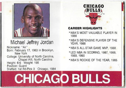 A vintage Chicago Bulls trading card featuring Michael Jeffrey Jordan with a portrait, biographical details, and career highlights on a white background with a red banner at the bottom.