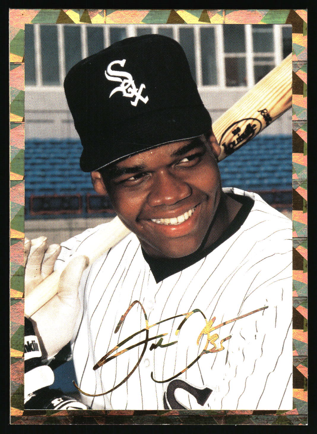 An autographed baseball trading card featuring a Frank Thomas in a black Chicago White Sox cap and white pinstripe uniform, holding a bat, with a decorative border around the card.