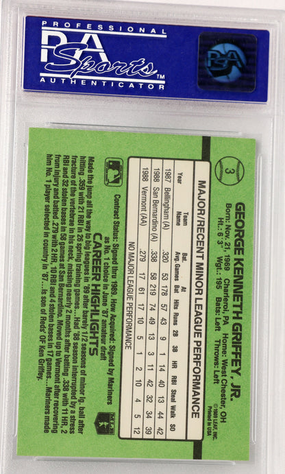 A collectible sports card of George Kenneth Griffey, Jr., with a green border asealed in a PSA Sports Authenticator protective case.d white text box showing player statistics.