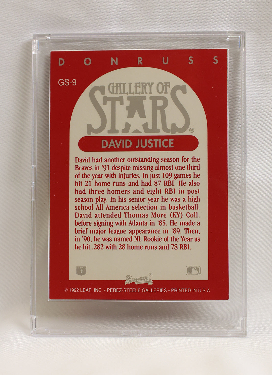 Back of 1992 Donruss Triple Play Gallery of Stars #GS-9 David Justice card in plastic case, showing player bio and stats on red background