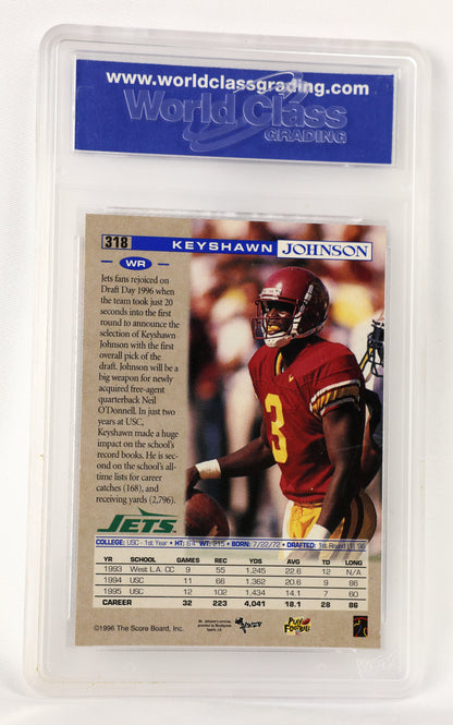 A 1996 Keyshawn Johnson NFL trading card graded and encapsulated in a clear plastic holder by World Class Grading. The card features a photo of Johnson in a red football uniform with the number 3, and includes a blue header with player details and a statistics table at the bottom.