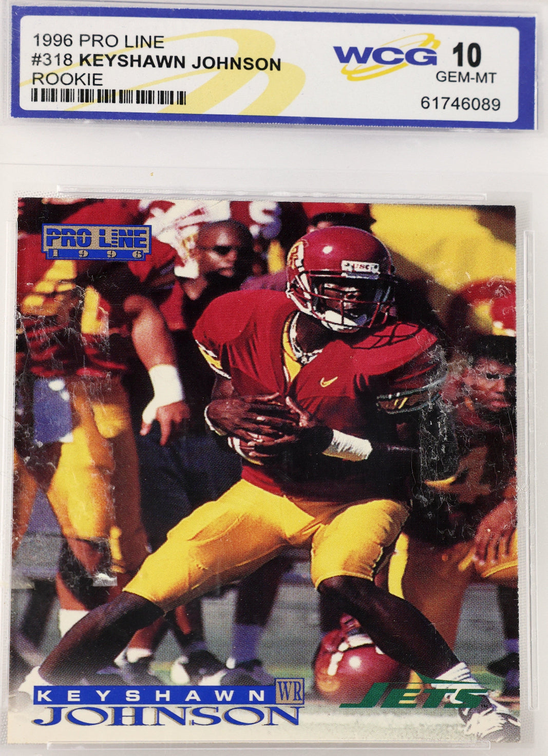 A 1996 Pro Line football card of Keyshawn Johnson, graded and encapsulated by WCG with a Gem-MIT 10 label. The card features Keyshawn in a red and yellow uniform, and the card is sealed inside a clear plastic protective case.