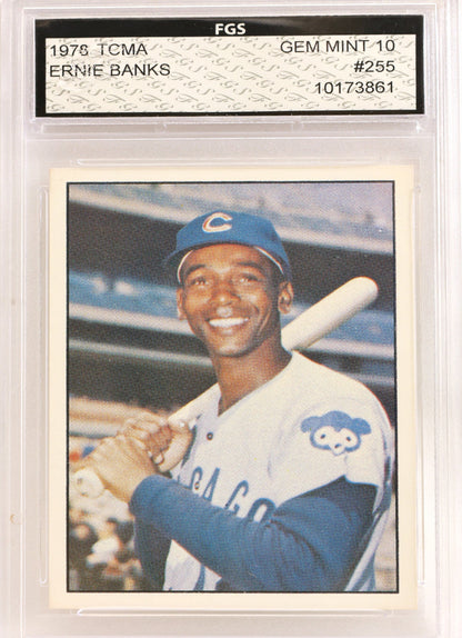 A 1976 Chicago Cubs baseball trading card of Ernie Banks, graded and encapsulated by FGS with a Gem Mint 10 label. The card shows Ernie Banks in a blue and white uniform holding a bat.