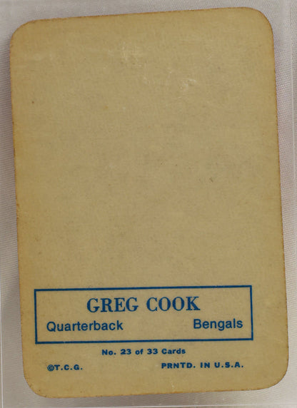 A vintage football trading card featuring Greg Cook of the Baltimore Bengals, displayed inside a clear protective plastic case on a light background.