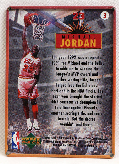 A vintage-style basketball trading card featuring Michael Jordan in a red and white Chicago Bulls uniform, with the number 23 and a red banner reading Michael Jordan. The card includes a block of text about his 1992 season and an Upper Deck logo at the bottom.