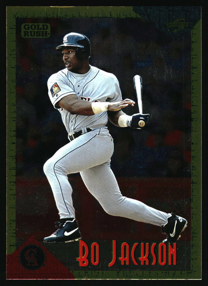 A vintage baseball trading card featuring Bo Jackson in a batting pose, wearing a gray uniform and black helmet. The card has a dark background with a green border and red text reading 'BO JACKSON' at the bottom.