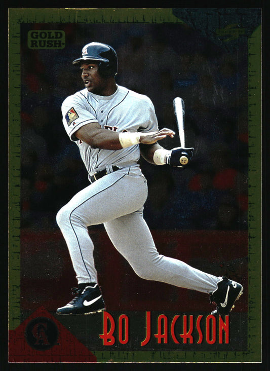 A vintage baseball trading card featuring Bo Jackson in a batting pose, wearing a gray uniform and black helmet. The card has a dark background with a green border and red text reading 'BO JACKSON' at the bottom.