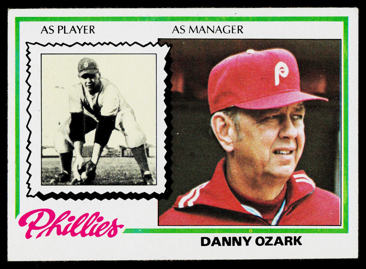A vintage baseball trading card featuring Danny Ozark, with a black-and-white photo at the top and a color portrait wearing a red Phillies cap at the bottom. The card includes text reading 'Phillies', 'Danny Ozark', and 'As Player' and 'As Manager'.